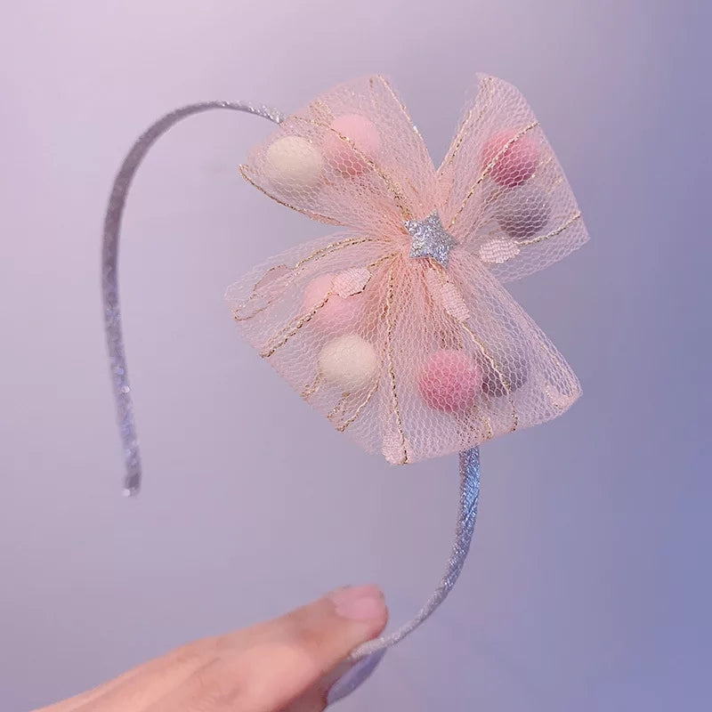 DIADEMA DE MOÑO CON POMPONES