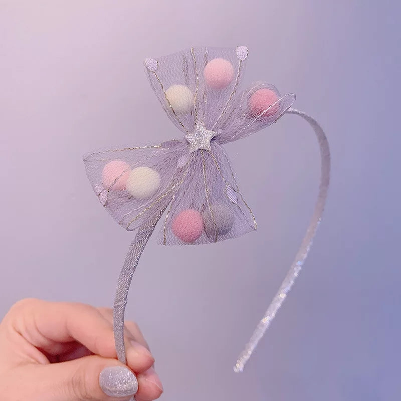 DIADEMA DE MOÑO CON POMPONES